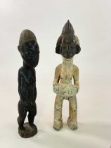 Two carved wooden African figures, height 51cm.