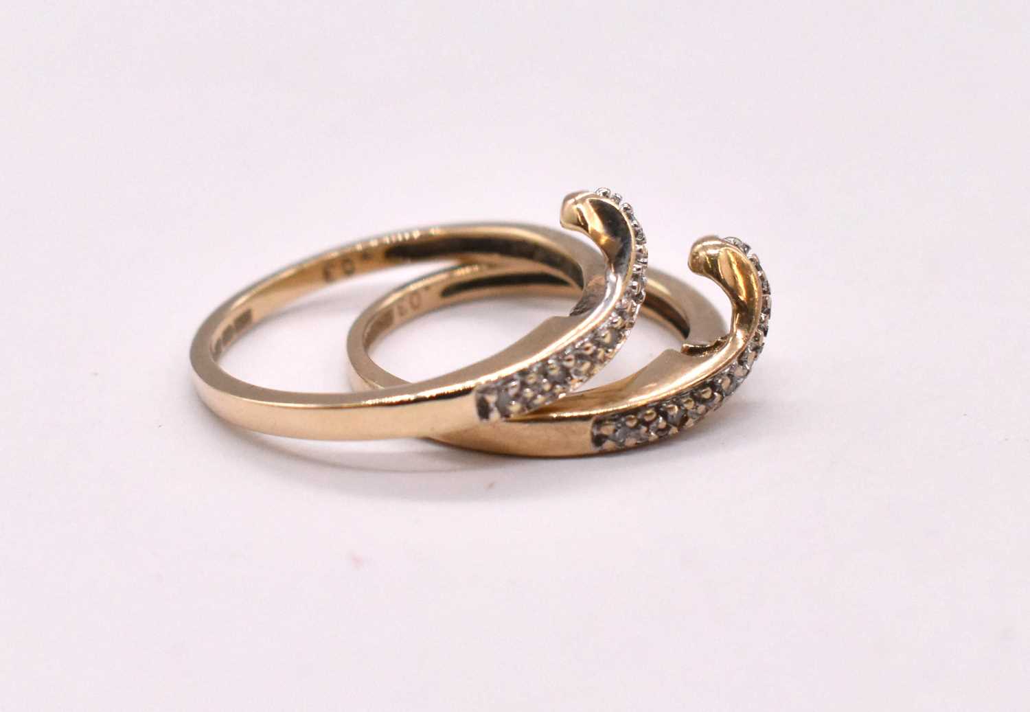 A pair of 9ct yellow gold diamond set swept wishbone designed rings, combined approx. 3.75g. - Image 2 of 3