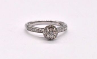 A 9ct white gold diamond set halo ring, totalling approx. 0.25cts, size O, approx. 2.15g.