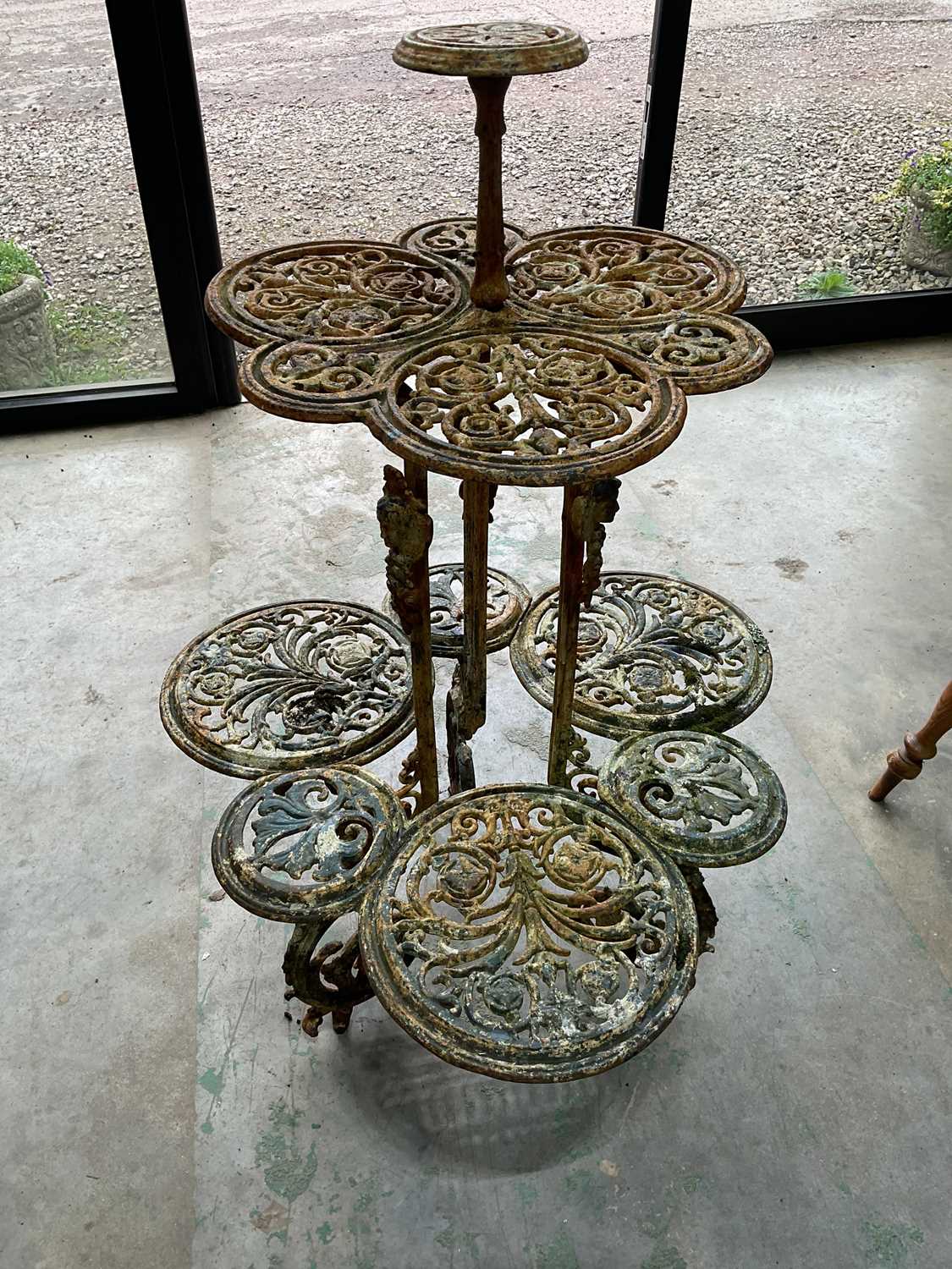 A cast iron painted plant stand, height 118cm, diameter 80cm. Condition Report: General integrity of