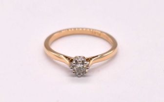 An 18ct yellow gold platinum tipped eight claw set round brilliant cut diamond solitaire ring, the