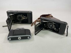 Two vintage Kodak bellows cameras, and another (3)