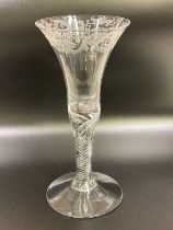 An English engraved air twist wine glass, circa 1750, the engraving possibly Dutch, with bell shaped