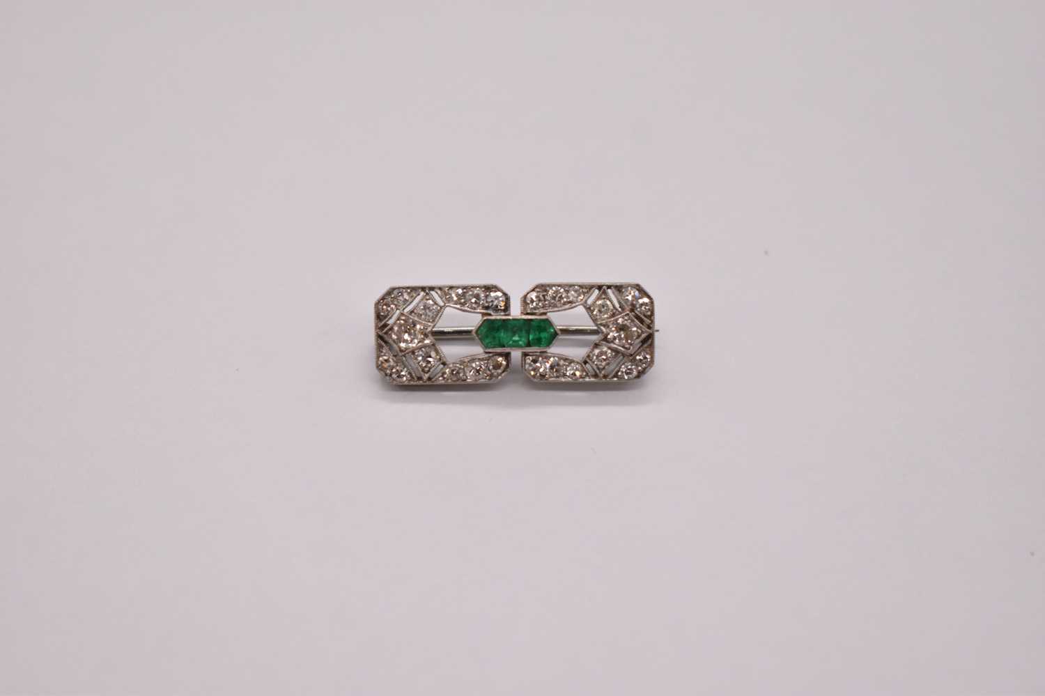 An Art Deco white metal emerald and diamond brooch set with three emeralds to the central raised - Image 5 of 6