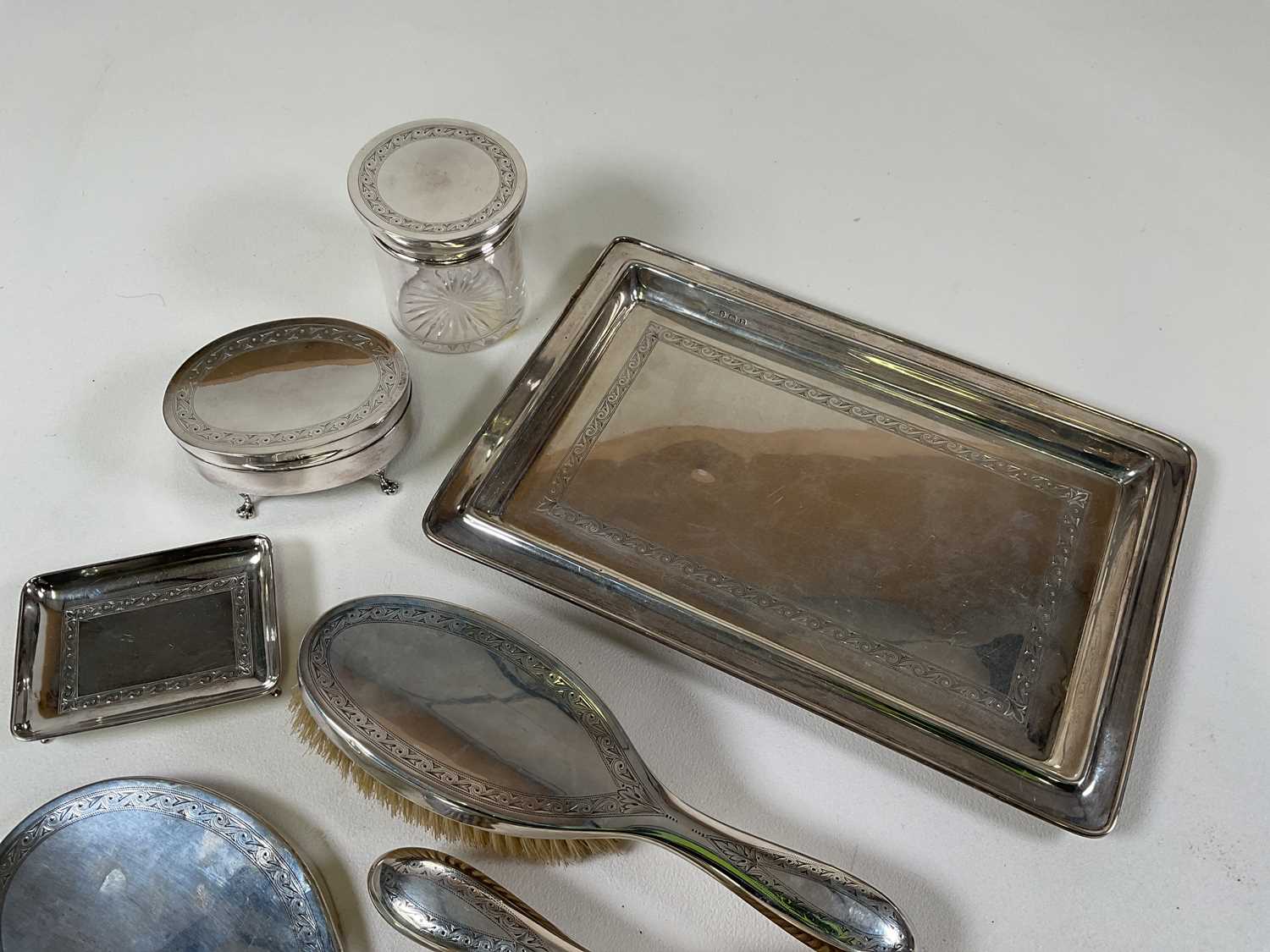 A George V hallmarked silver ten piece dressing table set comprising tray, small pin dish, jewellery - Image 2 of 4