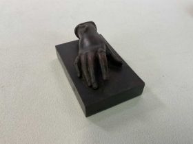 BONAPARTE INTEREST; a small bronze cast hand of Empress Eugenie with the asp emerging from her