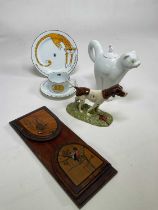 A collection of ceramics comprising a Carltonware cat teapot, Royal Doulton dog, Karen Weston trio
