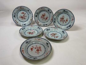 A set of six late 18th/early19th century Chinese shallow bowls, sparsely painted witih gilt