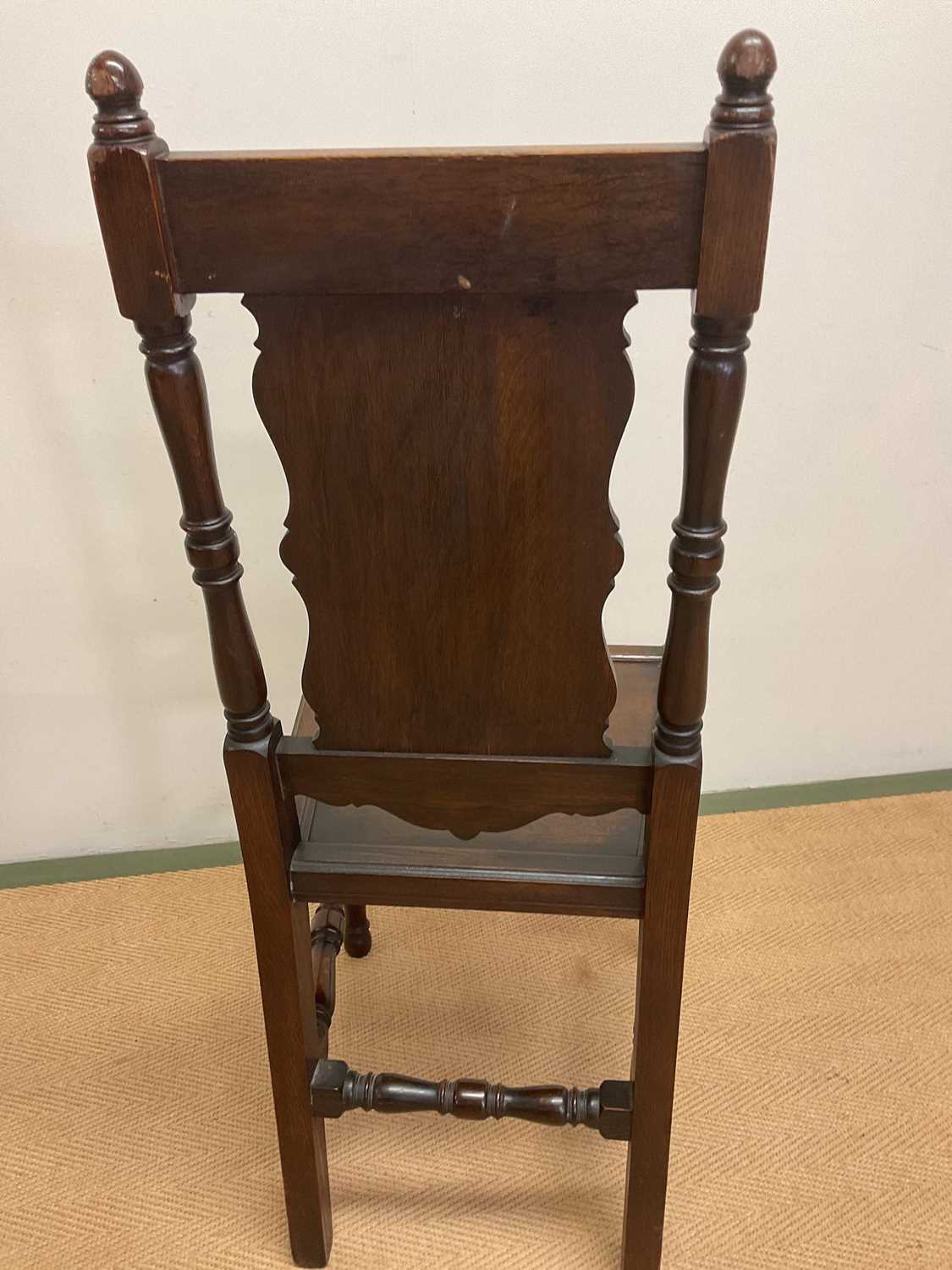 A 19th century oak panel back side chair with panel seat and carved central motif of a flower on the - Image 4 of 4