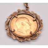 An Edward VII full sovereign, 1910, Perth mint, loosely set in a 9ct yellow gold mount and suspended