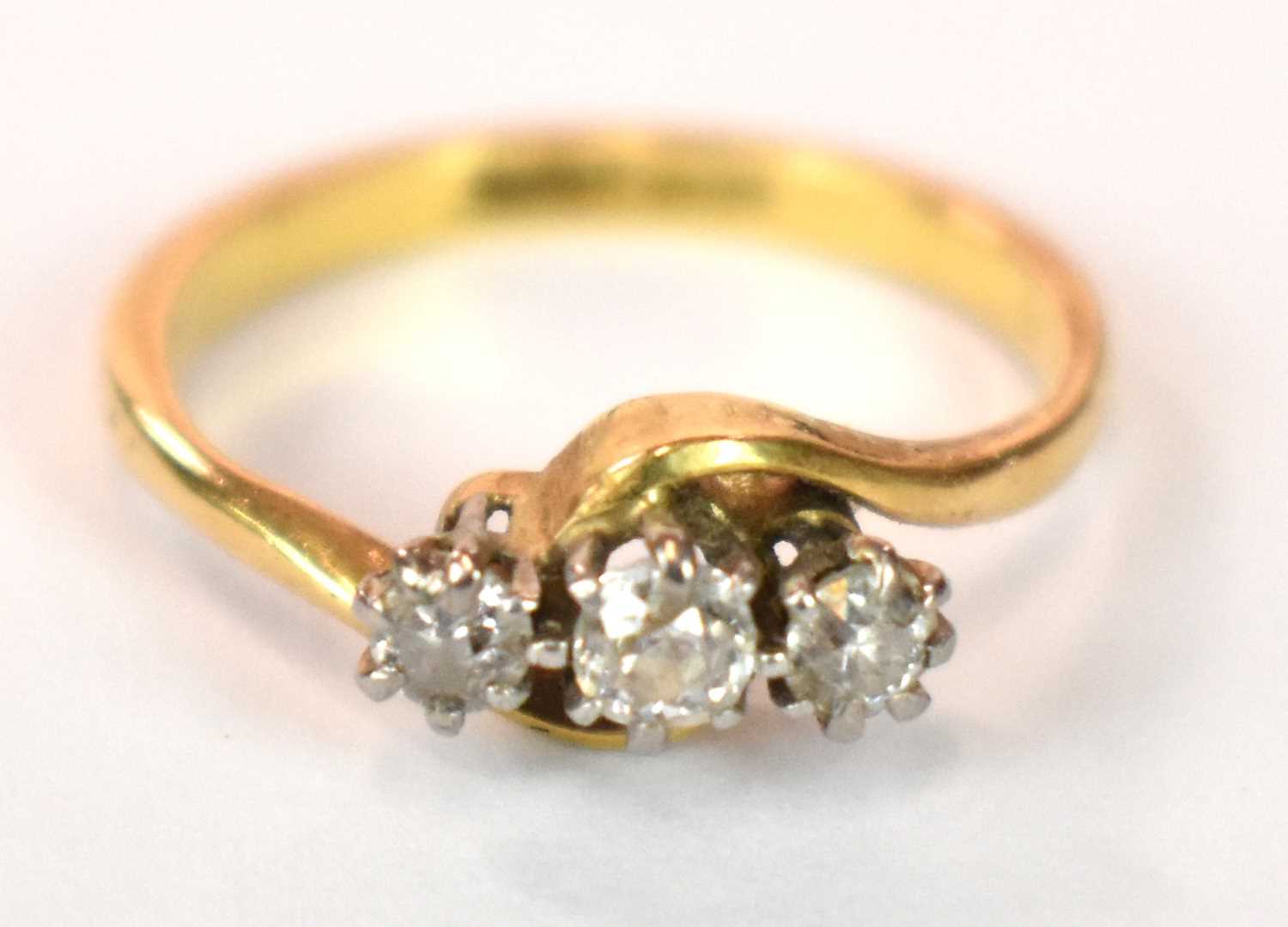 An 18ct yellow gold platinum tipped three stone diamond ring in swept setting, size J, approx. 3g. - Image 2 of 7