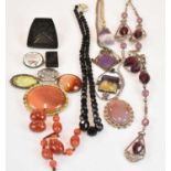 A group of jewellery, including a Blue John brooch, Celtic inspired brooch, amber beads, carnelian