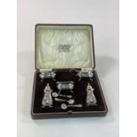 A cased George V hallmarked silver five piece cruet, comprising pair of open salts, lidded mustard