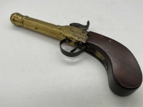 A 19th century Belgian percussion cap pistol with walnut stock and an octagonal turned brass