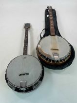 An Antonia four string banjo and a German five string banjo in soft carrying case (2)
