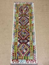 A Chobi Kilim runner, 193 x 65cm.