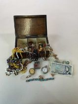 A quantity of costume jewellery contained within a Victorian walnut box.