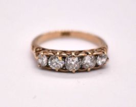 An 18ct yellow gold five stone diamond ring, the central stone weighing approx. 0.33cts, with