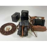 A cased Agfa camera, a pair of field glasses, a box camera, money box and a carved Chinese