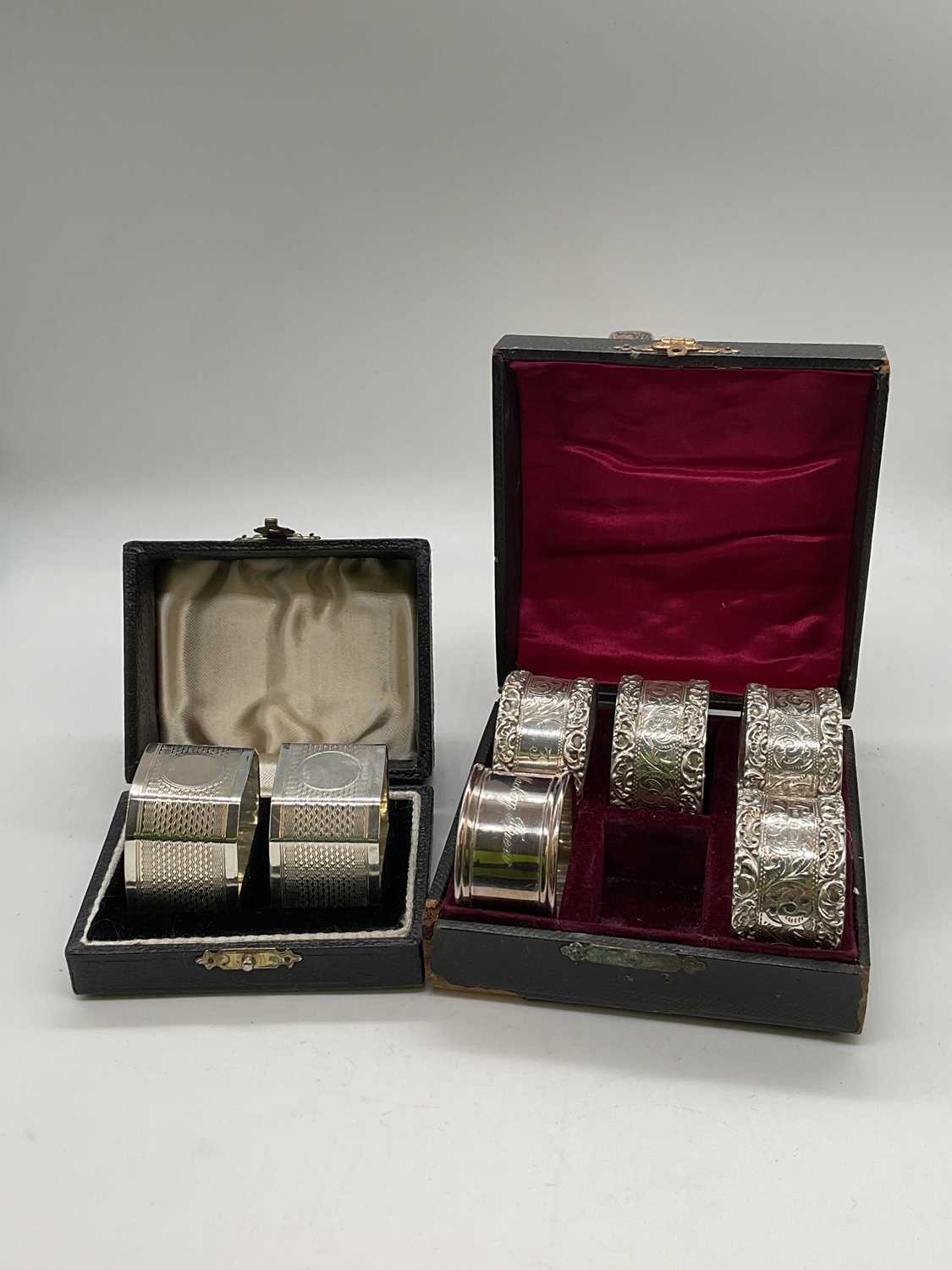 A set of four Edwardian hallmarked silver napkin rings with engraved central band and numbered 1 -