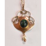 IN THE MANNER OF MURRLE BENNETT; a 9ct gold turquoise and seed pearl Art Nouveau pendant suspended