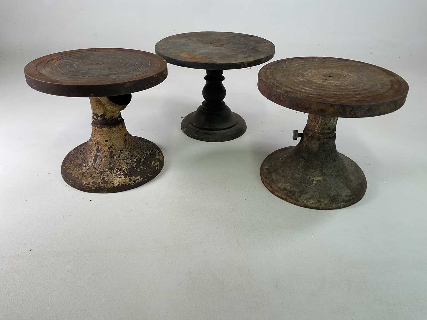 Three early 20th century cast iron potters painting wheels, reputedly from the Wedgwood factory
