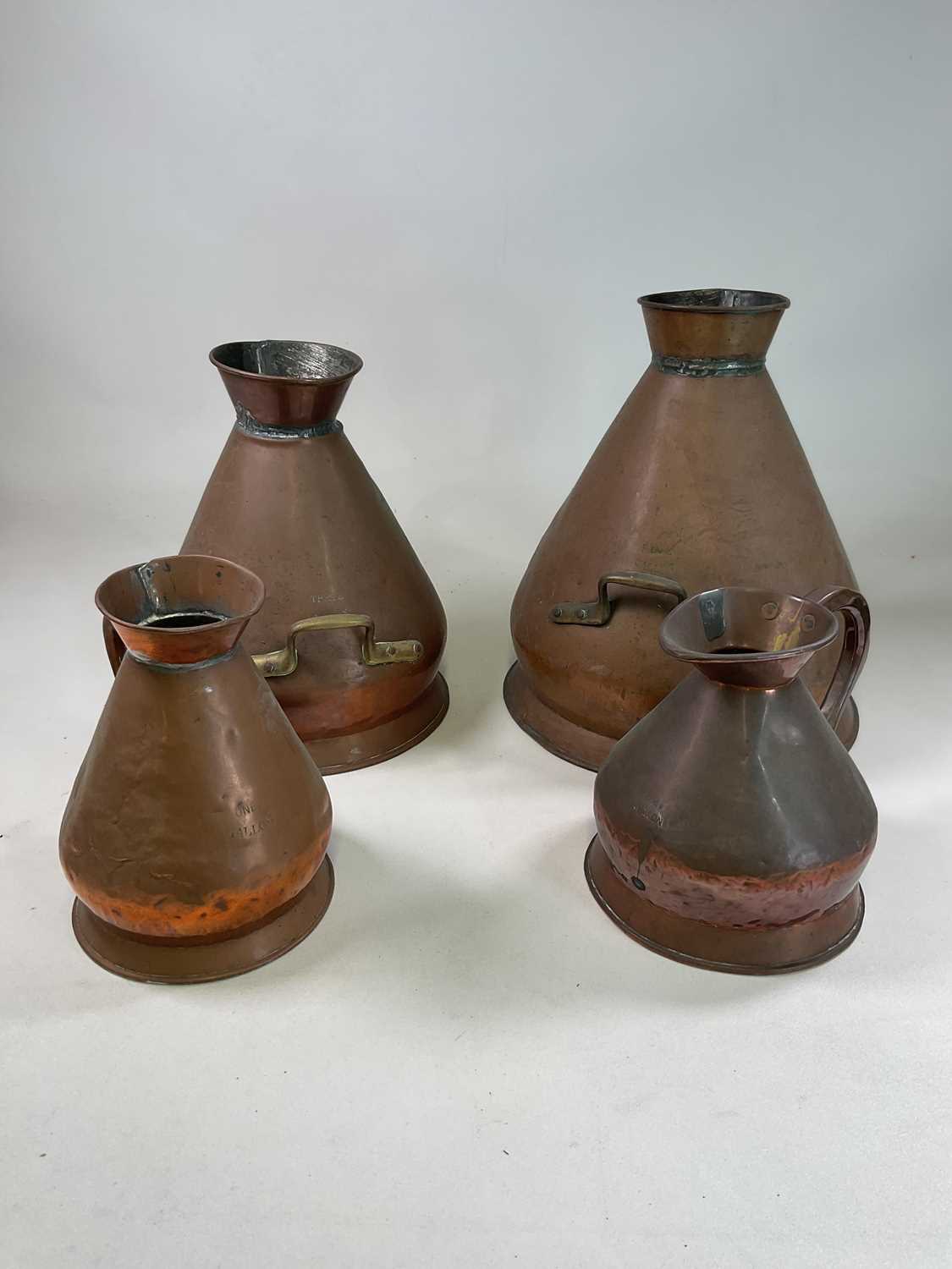 A set of three graduated copper harvest jugs comprising five gallon, three gallon and a one - Image 2 of 2