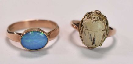 A 9ct yellow gold and opal dress ring, size S 1/2, and a further 9ct gold ring set with a scarab,