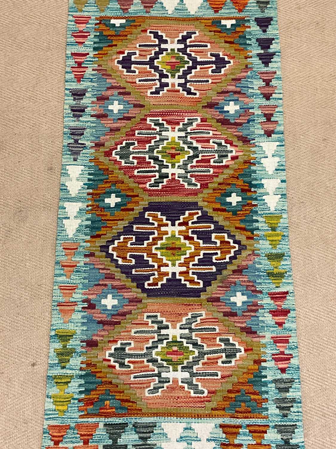 A Chobi Kilim runner, 147 x 61cm.