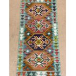 A Chobi Kilim runner, 147 x 61cm.