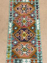 A Chobi Kilim runner, 147 x 61cm.