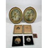 A pair of Georgian oval silk work embroideries in gilt frames, with two miniatures, a