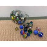 A collection of marbles including some large examples.