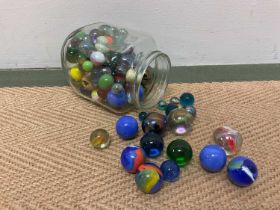 A collection of marbles including some large examples.