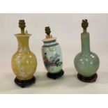 Three Oriental lampbases comprising a celadon style crackle glazed example, a decorative yellow