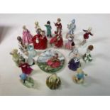 A quantity of Royal Doulton and Worcester figures, some F G Doughty, including 'Top O' the Hill', '