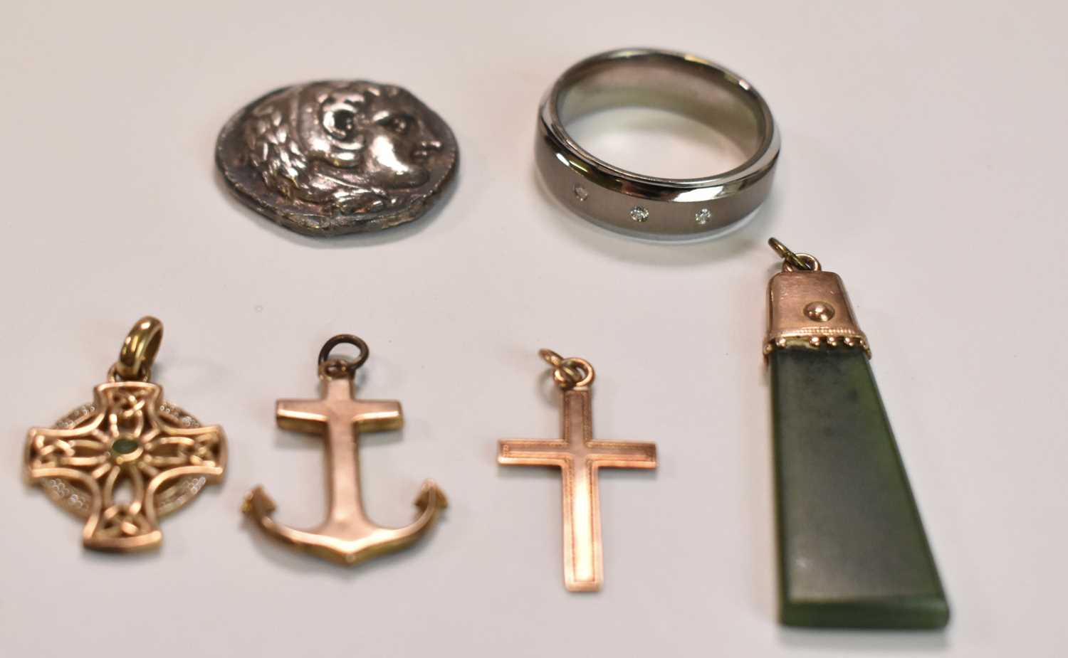 Three 9ct yellow gold pendants; one anchor and two in the form of a cross, combined approx 4.2g, - Image 2 of 3