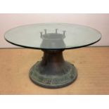 A dining/centre table incorporating the top section of a whisky still, with circular glass top,