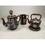 BARGEWARE; a glazed teapot, kettle on stand and jug of large proportions, height of teapot 32cm.