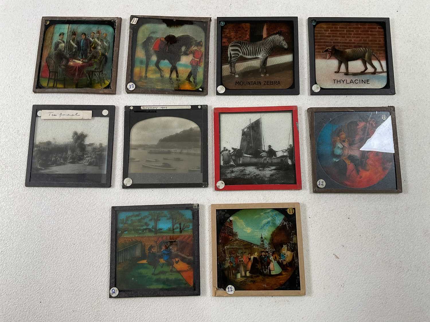 Four magic lanterns in metal cases with a box of slides in wooden frames featuring the Pilgrim's - Image 6 of 6