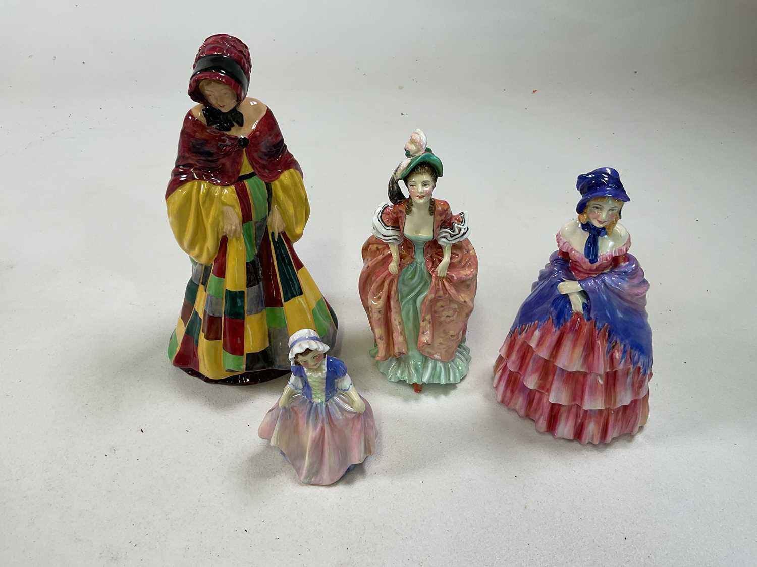ROYAL DOULTON; a collection of four figures comprising HN564 'The Parson's Daughter', HN1835 '