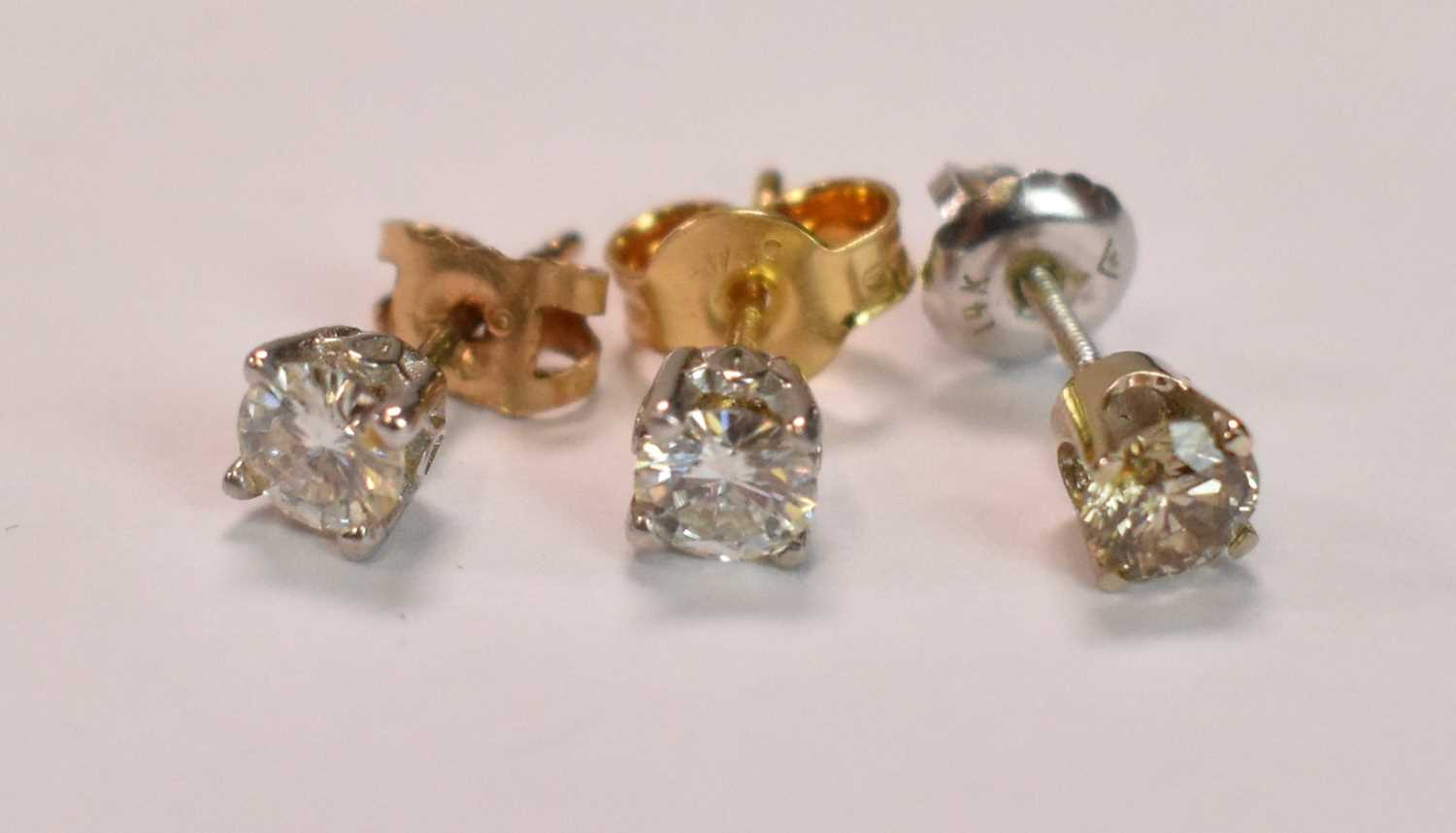 Three single diamond set ear studs, each round brilliant cut four claw set stone weighing approx 0. - Bild 2 aus 2