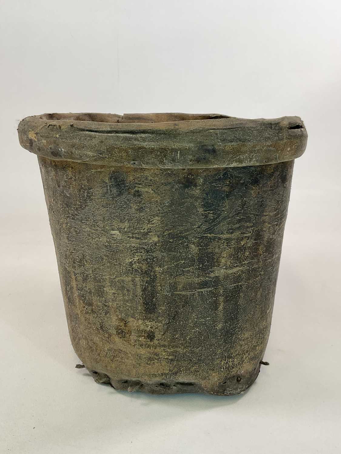 An elephant hide bucket, height 41cm, diameter 44cm.