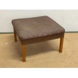 A mid 20th century Danish square leather footstool with beech legs, 39 x 62cm.