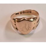 An Edwardian 9ct gold signet ring with engraved initials to the shield shaped platform, Chester