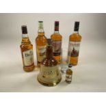 WHISKY; three bottles of The Famous Grouse whisky, all 1ltr, a Wade ceramic decanter of Bell's