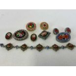 A group of micromosiac jewellery, including bracelet, several brooches, and two pairs of clip on