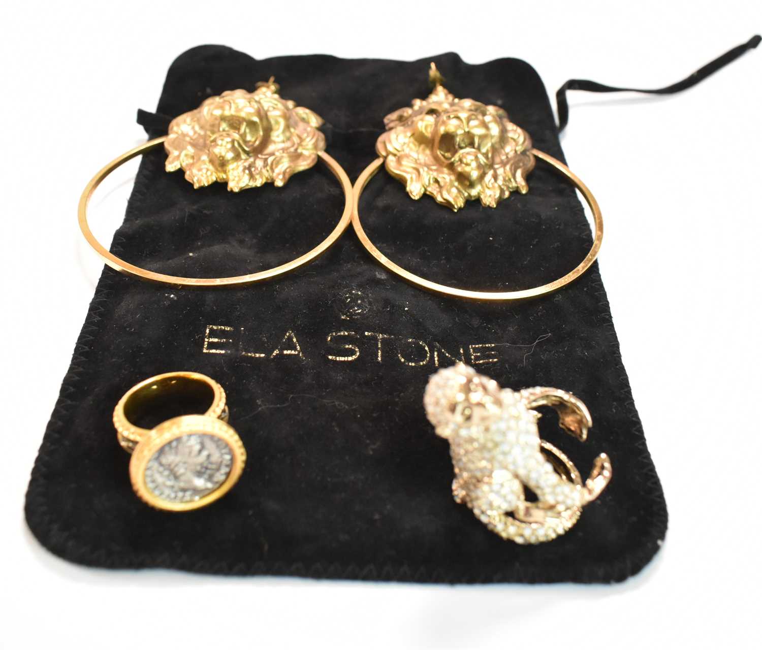 ELA STONE OF PARIS; a pair of costume jewellery large hoop earrings set with a lion's head, length