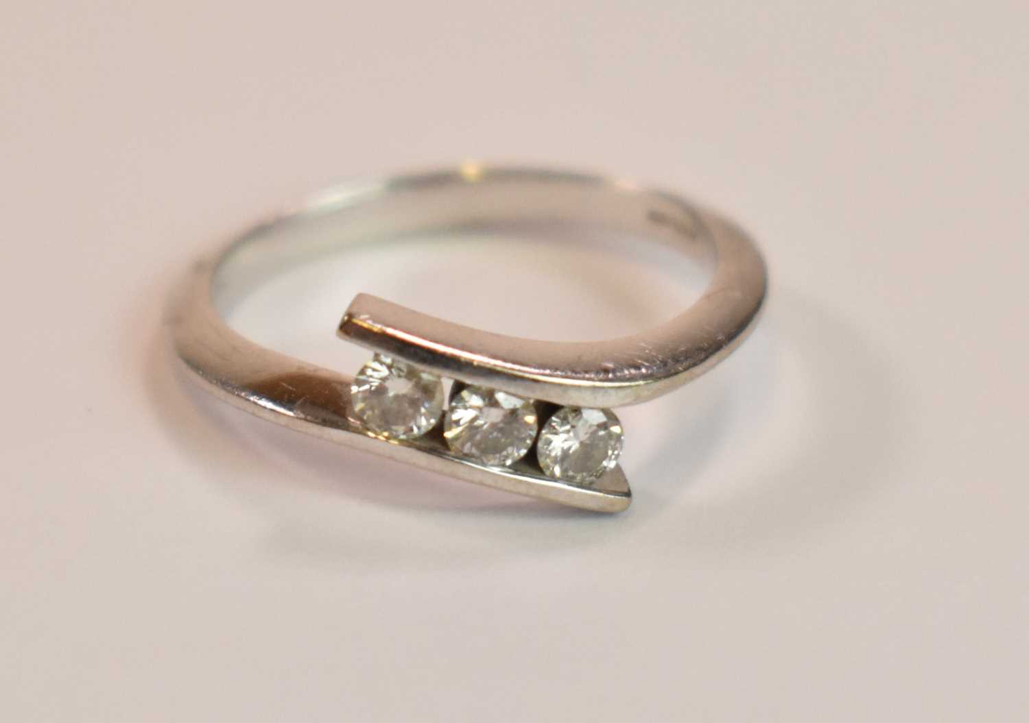 An 18ct white gold and diamond three stone channel set ring, size P, accompanied with the - Bild 3 aus 3