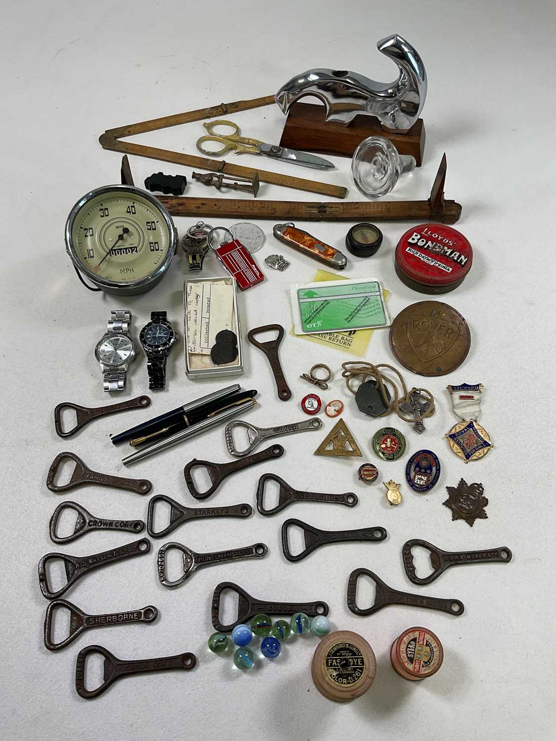 Collectors' items including Smiths speedometer, a selection of brewery bottle openers, chrome